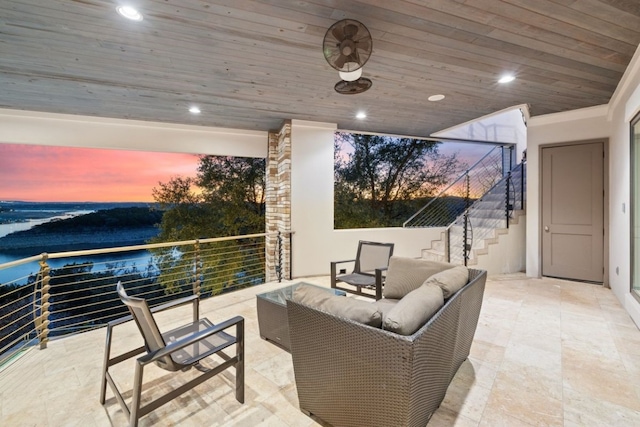 patio terrace at dusk featuring outdoor lounge area