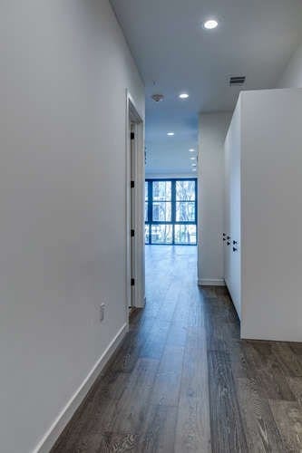 hallway featuring dark hardwood / wood-style floors