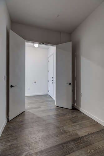 unfurnished room with hardwood / wood-style flooring