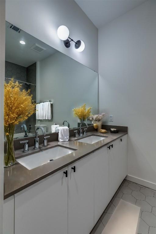 bathroom with vanity and tile patterned floors