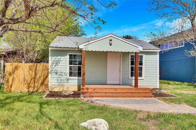211 E Burton St, Manor, TX 78653 - view of front of house with an outdoor structure and a front lawn