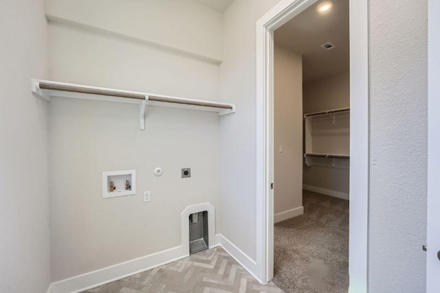 laundry room featuring electric dryer hookup, hookup for a gas dryer, washer hookup, and baseboards