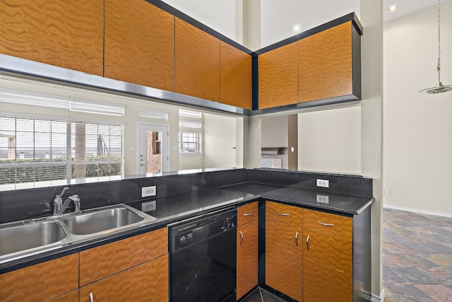 kitchen featuring dishwasher, a high ceiling, sink, and dark stone countertops