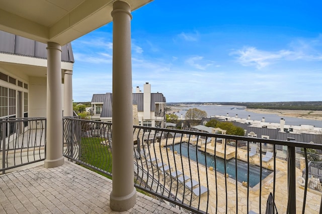 balcony featuring a water view