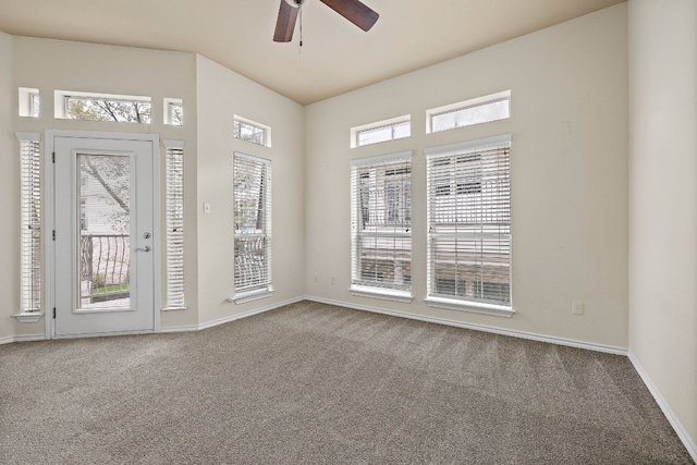 spare room with ceiling fan, carpet floors, and a healthy amount of sunlight