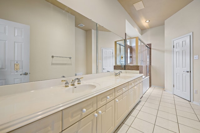 bathroom with toilet, vanity, tile patterned floors, and an enclosed shower