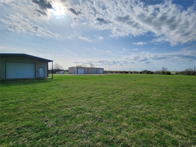 view of yard with a garage