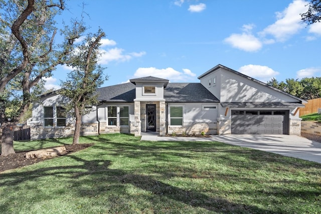 view of front of property with a front yard and a garage