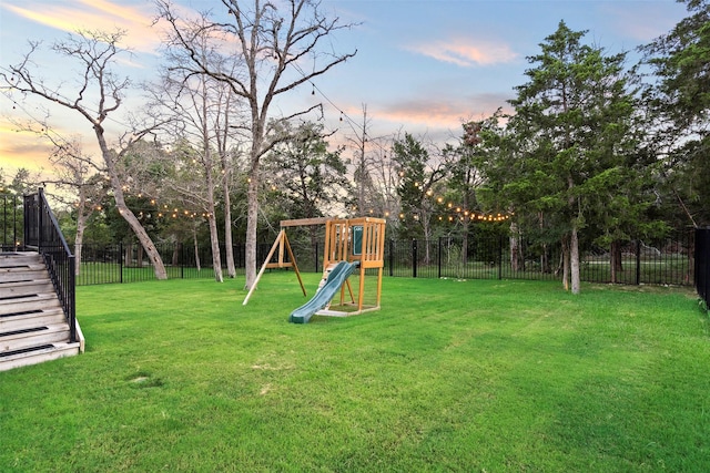 yard at dusk with a playground