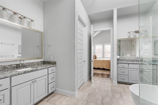 138 Loysoya St, Bastrop, TX 78602 - ensuite bathroom with vanity, a stall shower, and a freestanding bath