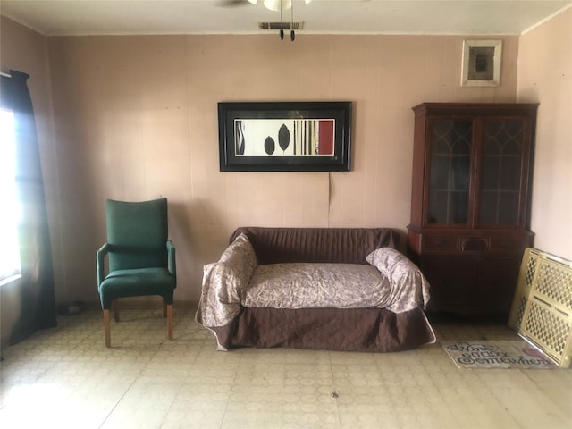 sitting room featuring ceiling fan