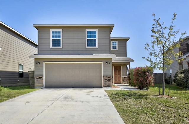 front facade featuring a front yard and a garage