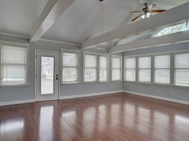 unfurnished sunroom featuring a wealth of natural light, ceiling fan, and vaulted ceiling with beams