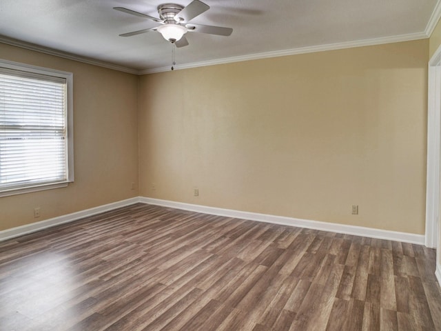 spare room featuring ceiling fan, crown molding, and dark wood-type flooring