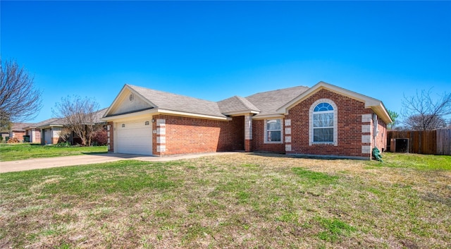 ranch-style home with a front lawn and a garage