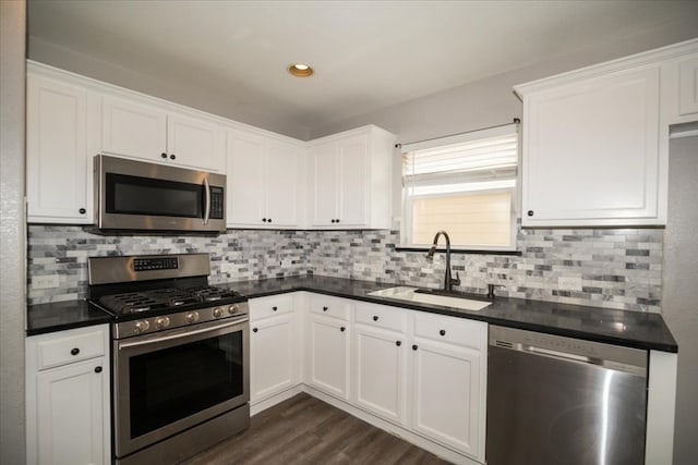 kitchen featuring white cabinets, dark hardwood / wood-style floors, sink, and stainless steel appliances