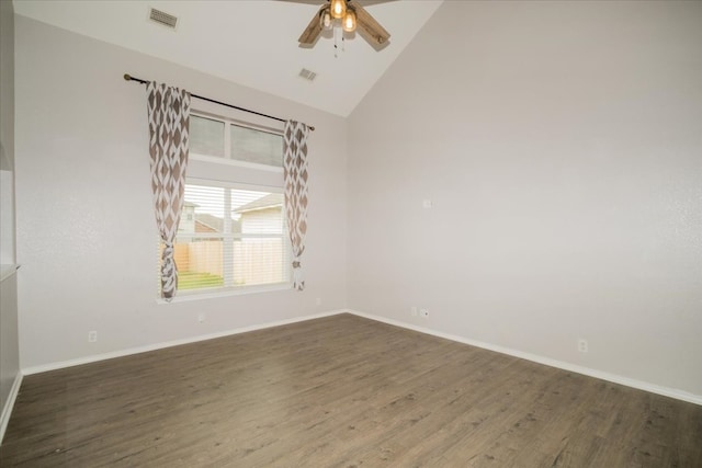 spare room featuring ceiling fan, dark wood-type flooring, and high vaulted ceiling