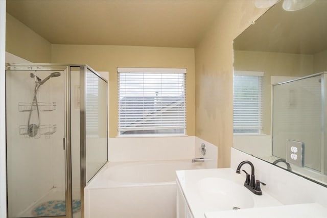 bathroom featuring independent shower and bath and vanity