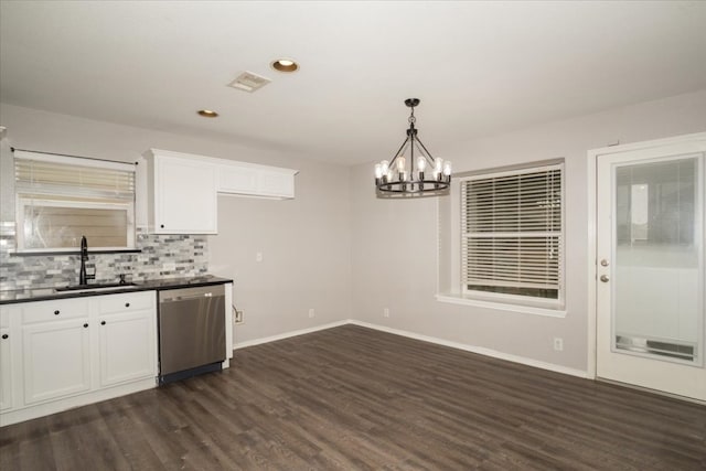 kitchen featuring a chandelier, dark hardwood / wood-style flooring, white cabinets, dishwasher, and sink