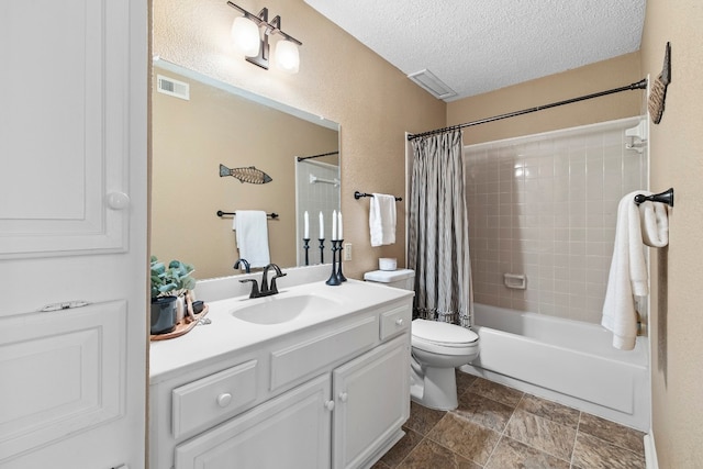 full bathroom featuring toilet, a textured ceiling, vanity, and shower / bath combination with curtain