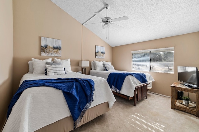 carpeted bedroom featuring lofted ceiling, a textured ceiling, and ceiling fan