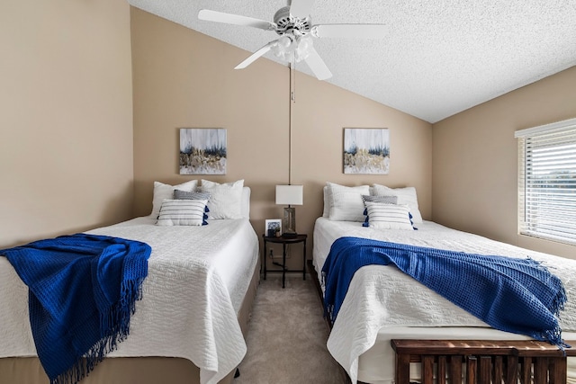 bedroom with carpet flooring, vaulted ceiling, a textured ceiling, and ceiling fan