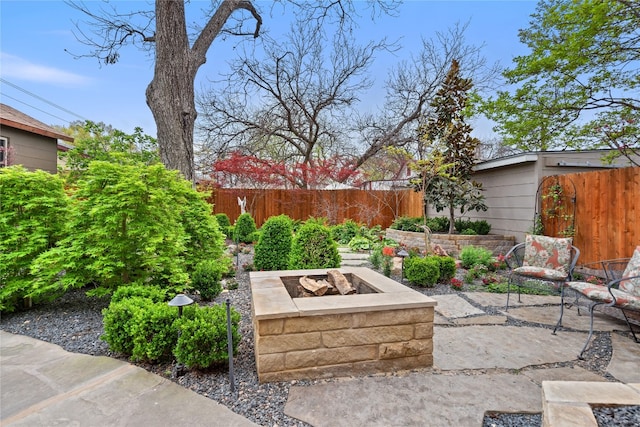 view of patio with an outdoor fire pit