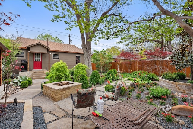 view of patio / terrace featuring an outdoor fire pit