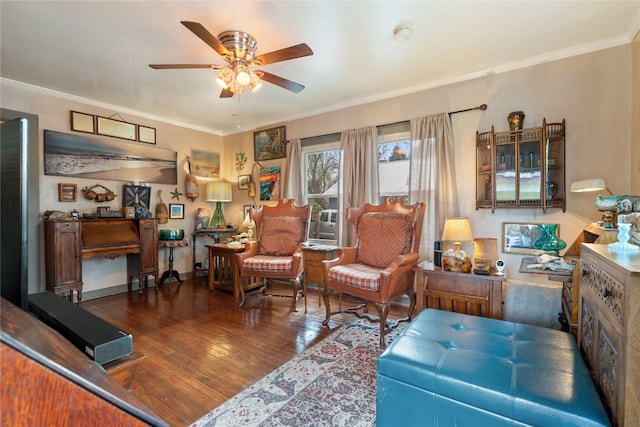 living room with hardwood / wood-style flooring, crown molding, and ceiling fan