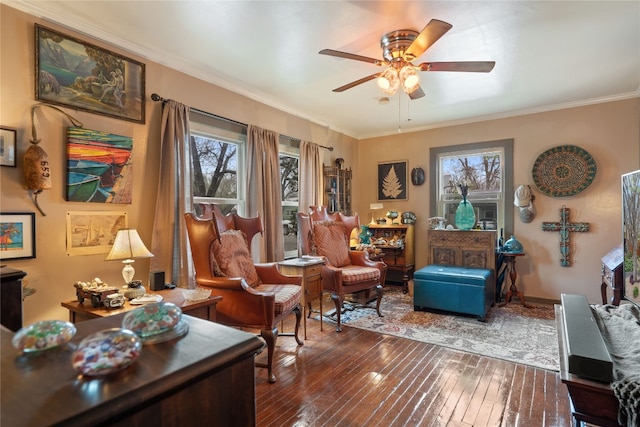 interior space featuring ceiling fan, a wealth of natural light, dark hardwood / wood-style flooring, and ornamental molding