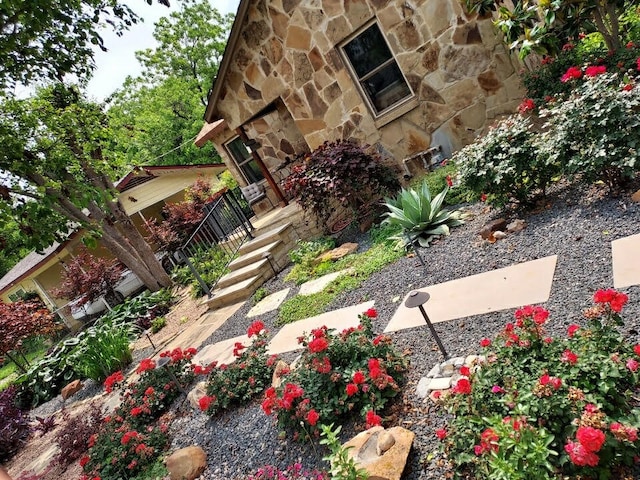 exterior space featuring a stone fireplace