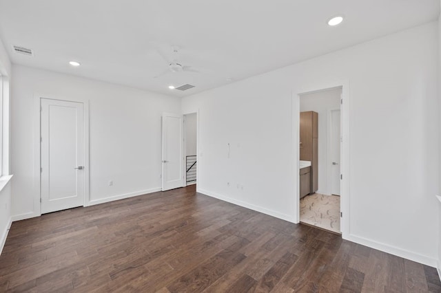 empty room with dark hardwood / wood-style flooring and ceiling fan