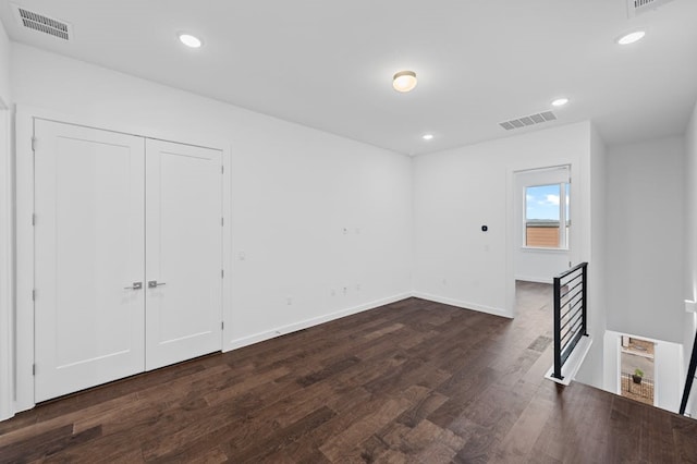 empty room featuring dark hardwood / wood-style floors