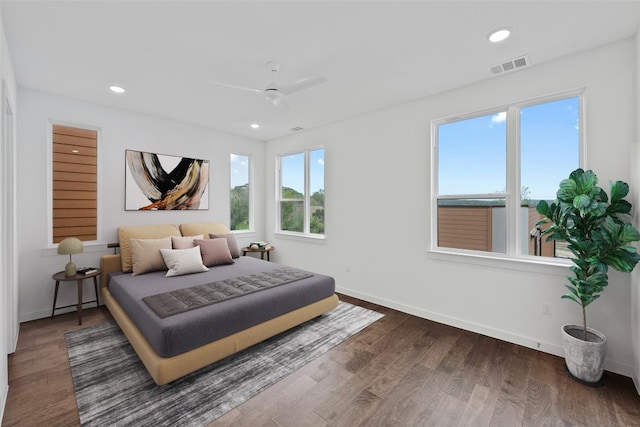 bedroom featuring ceiling fan and dark hardwood / wood-style floors