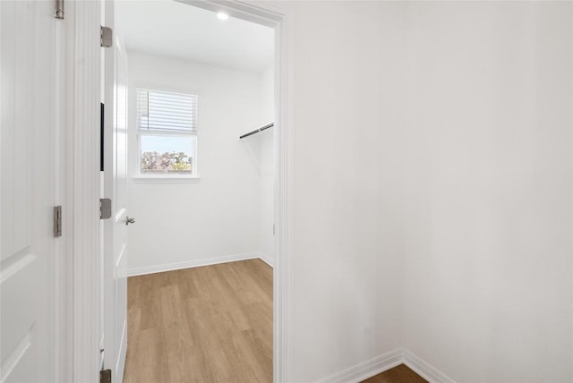 walk in closet featuring light wood-type flooring