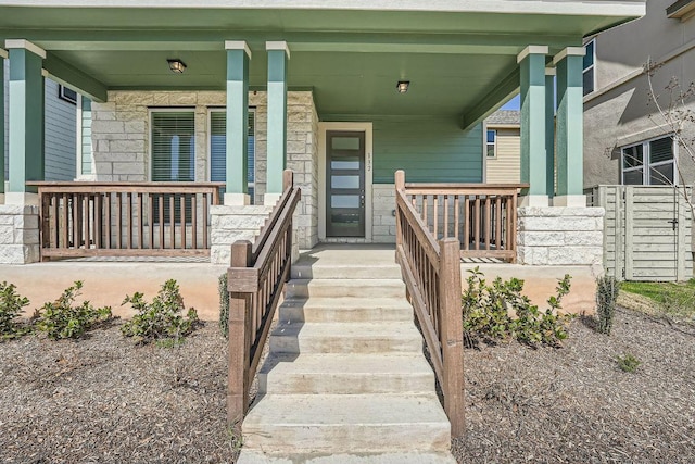 doorway to property featuring covered porch