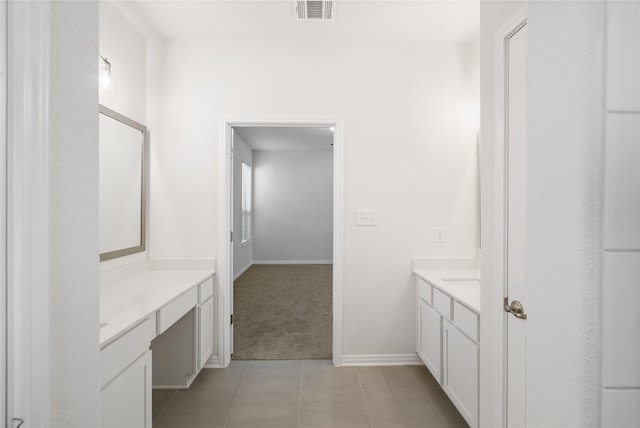 bathroom with vanity and tile patterned floors