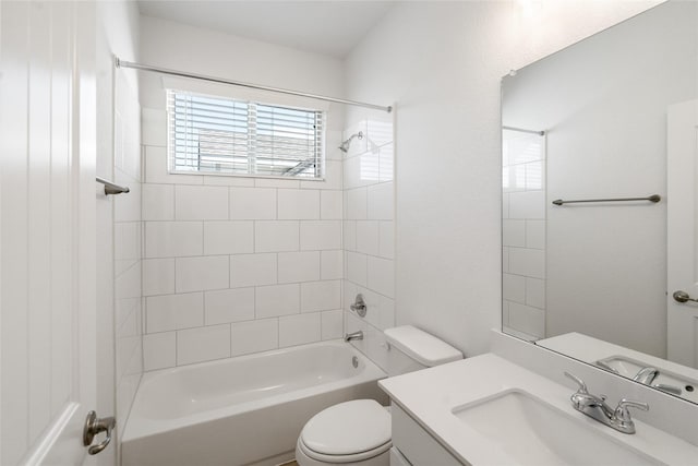 full bathroom with toilet, tiled shower / bath, and vanity