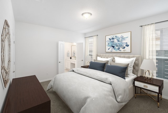 bedroom with carpet flooring and ensuite bath