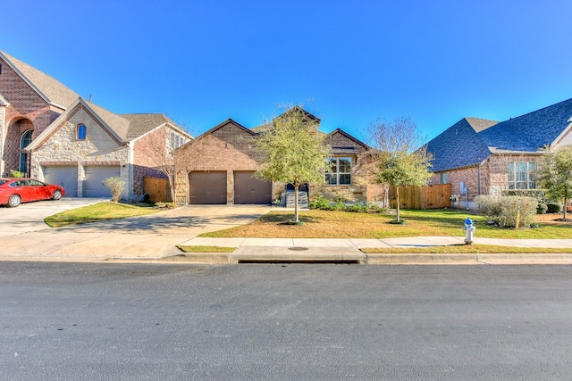 view of front of home with a front lawn and a garage