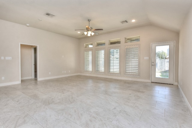 tiled empty room featuring ceiling fan and lofted ceiling