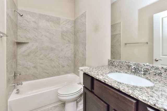 full bathroom with oversized vanity, toilet, tiled shower / bath, and tile flooring