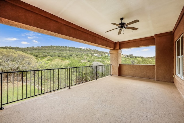 view of patio / terrace featuring ceiling fan and a balcony