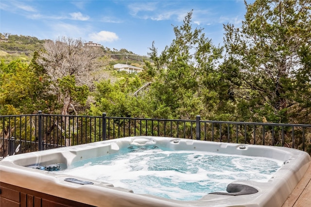 view of swimming pool featuring an outdoor hot tub