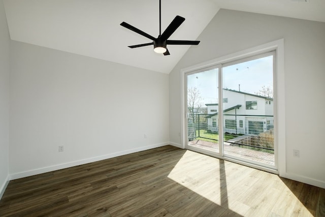 empty room with lofted ceiling, ceiling fan, and dark wood-type flooring