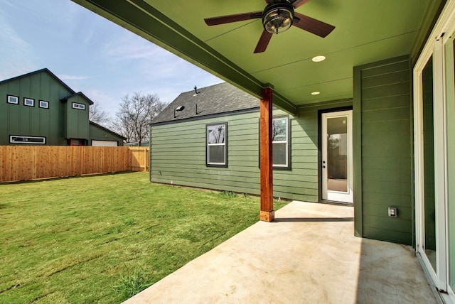 view of yard with a patio and ceiling fan