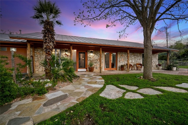 view of front of house with a yard