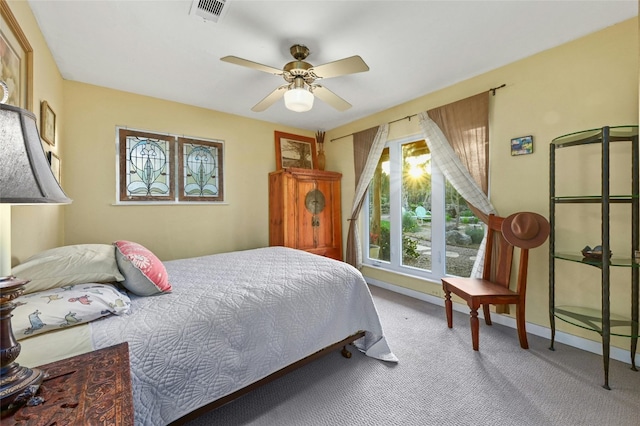 bedroom featuring light carpet and ceiling fan