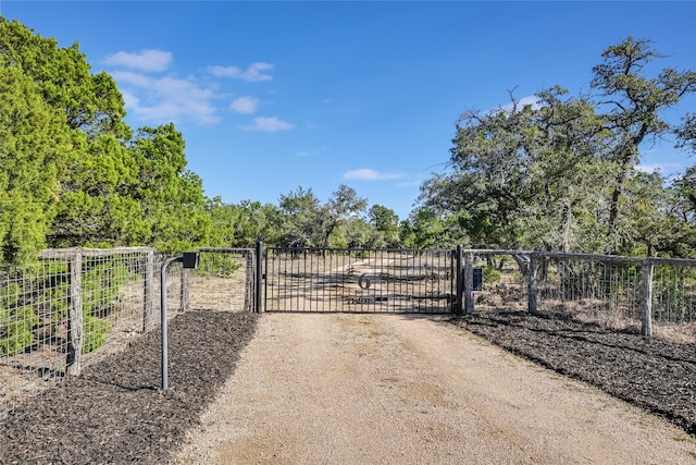 view of gate featuring a rural view