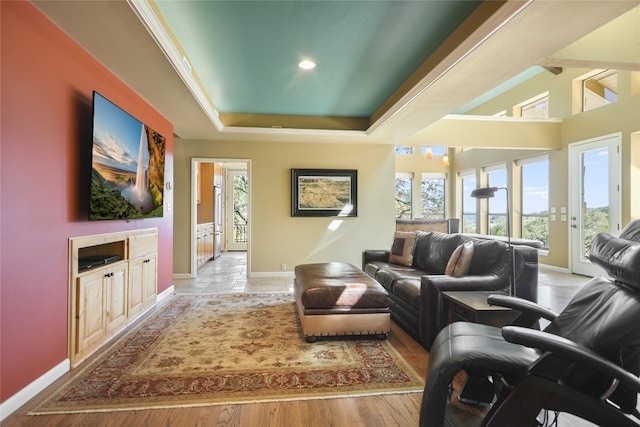 living room featuring light wood-type flooring and plenty of natural light